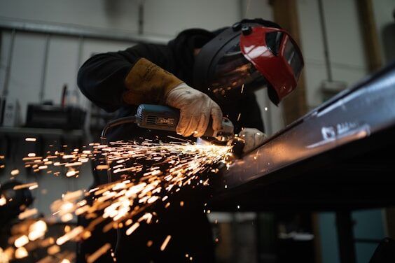 Sparks flying from metal grinding in a factory