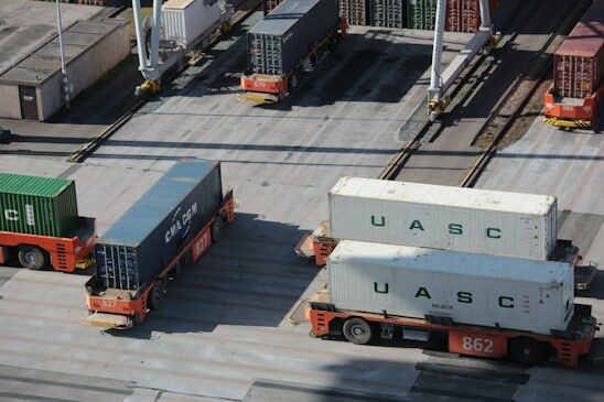 Shipping containers and trucks in a freight yard
