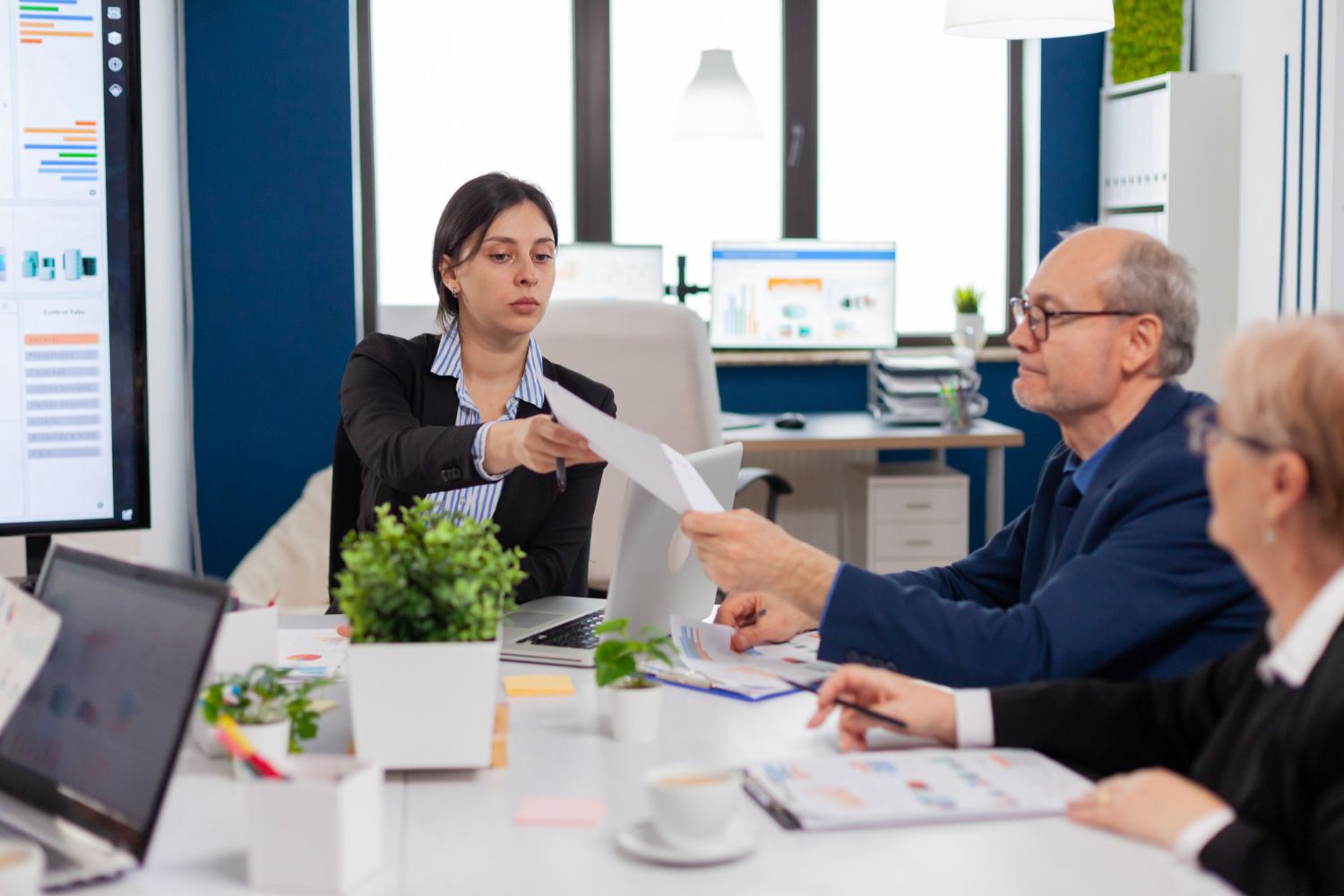 Audit team reviewing documents together in a meeting room