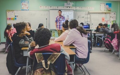 Students working at desks in a classroom