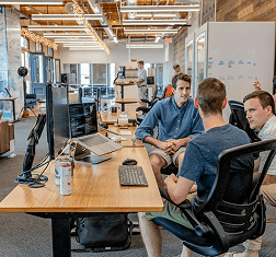 Accounting team collaborating at their desks